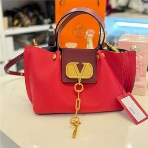 Valentino Red and Burgundy Shoulder Bag with Gold Hardware.
